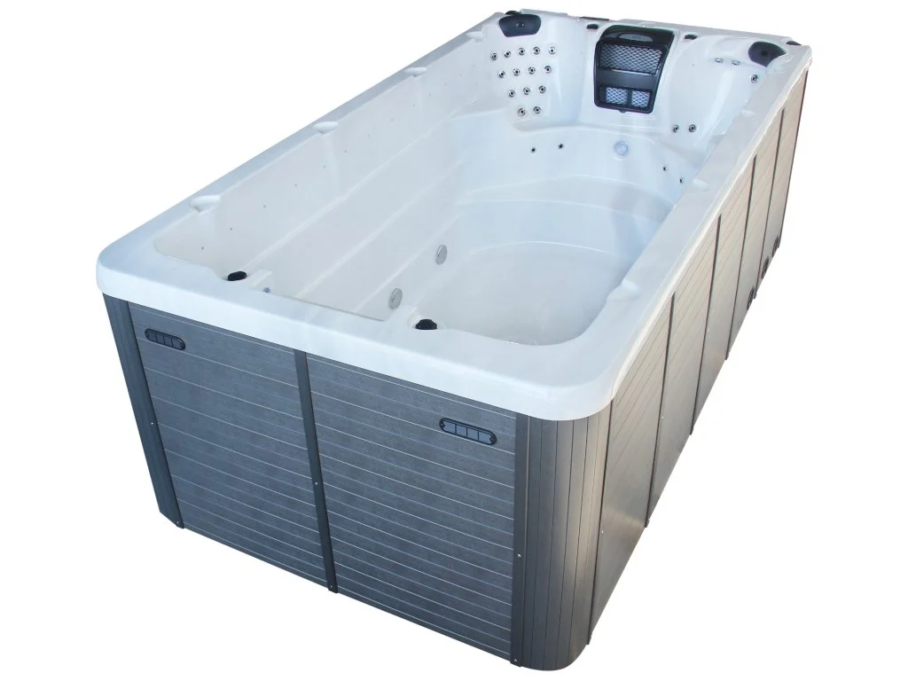 Piscina Swim Spa 805 are o formă rectangulară, cu un finisaj alb la interior și un exterior din material de culoare gri, având un design modern și elegant, cu locuri pentru două persoane și jeturi de hidromasaj integrate.